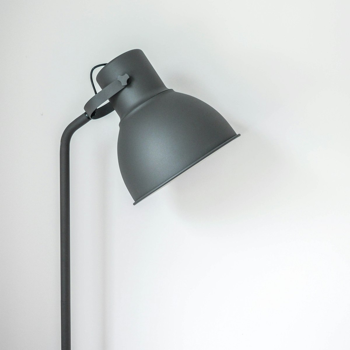 Grey metal floor lamp with an adjustable dome shade