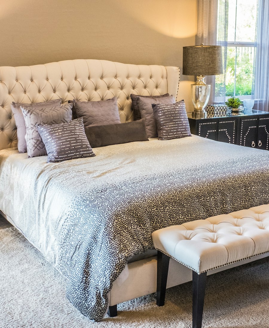 Bedroom with wooden and upholstered furniture